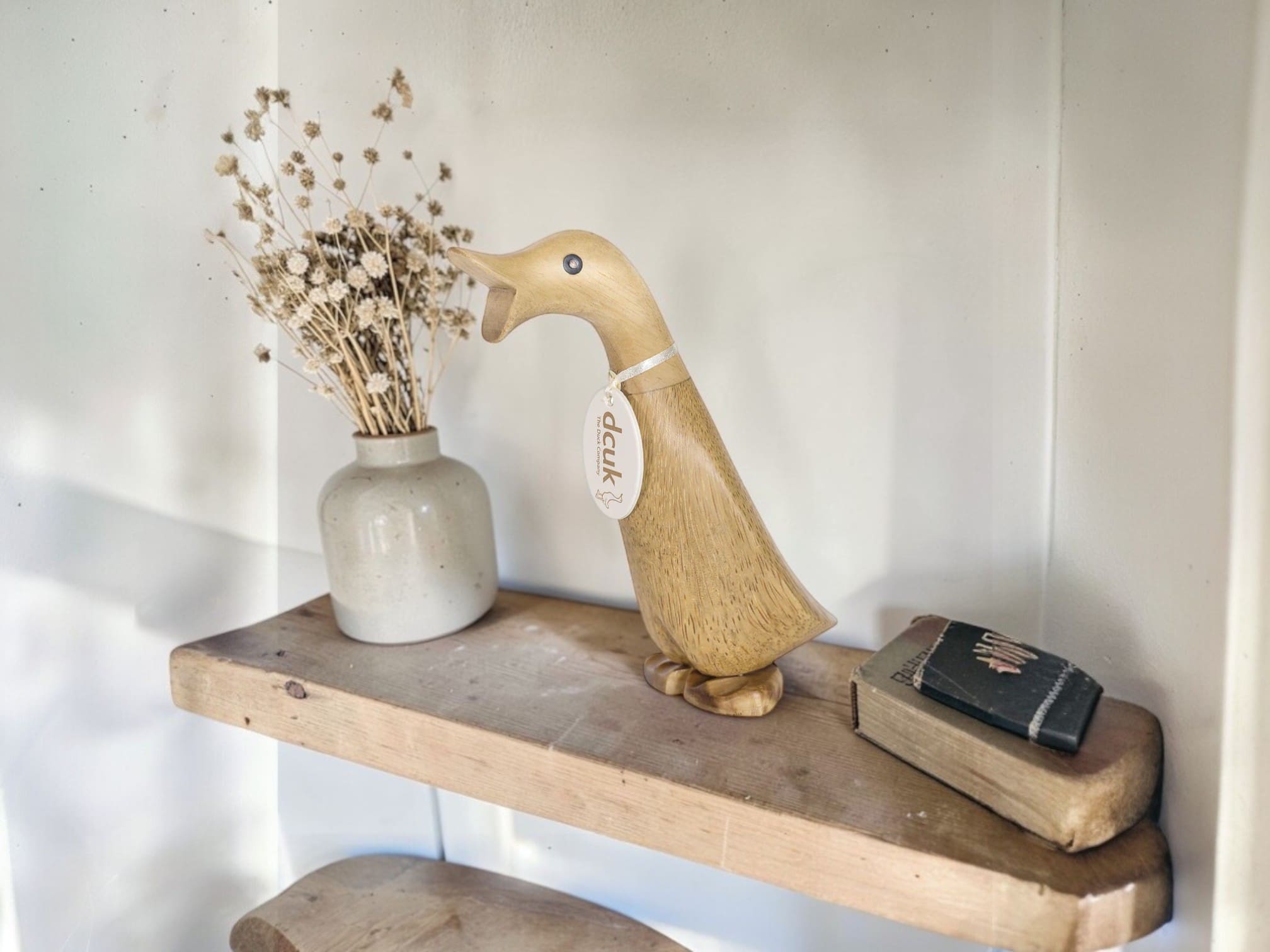 DCUK on wooden shelf